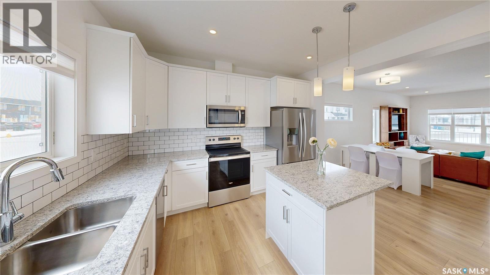 3100 Crosbie Crescent, Regina, SK - Indoor Photo Showing Kitchen With Stainless Steel Kitchen With Double Sink With Upgraded Kitchen