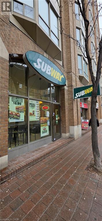 Entrance to property featuring brick siding - 132 Front Street E Unit# #1-B, Toronto, ON