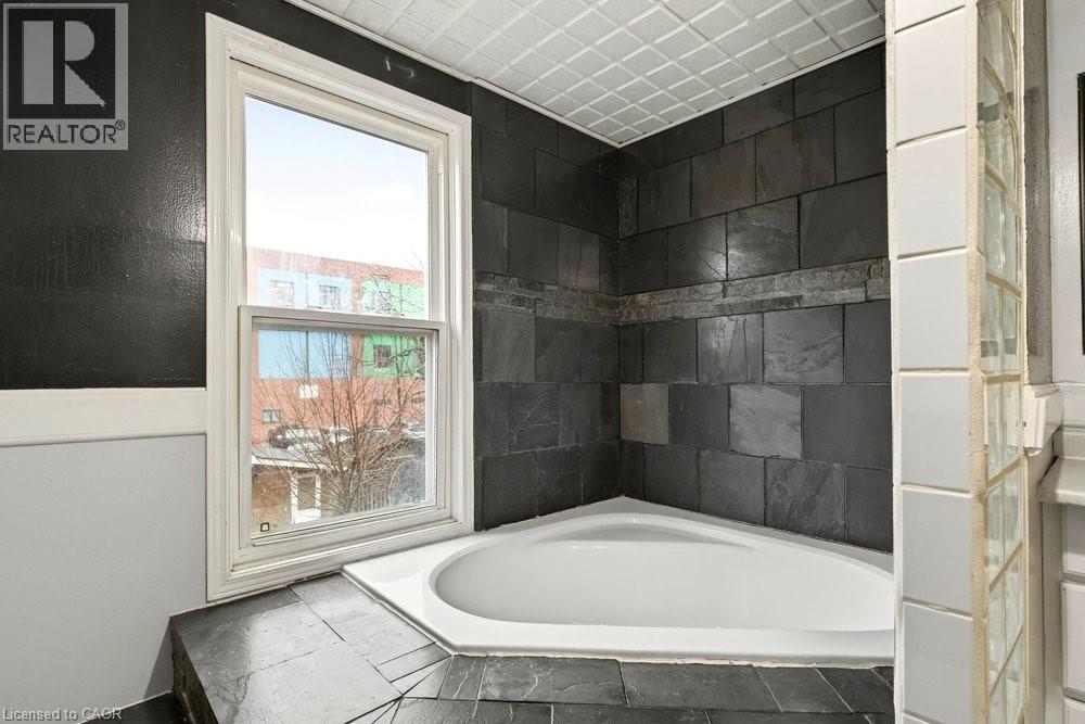 Bathroom with a garden tub - 23 Frederick Avenue, Hamilton, ON - Indoor Photo Showing Bathroom