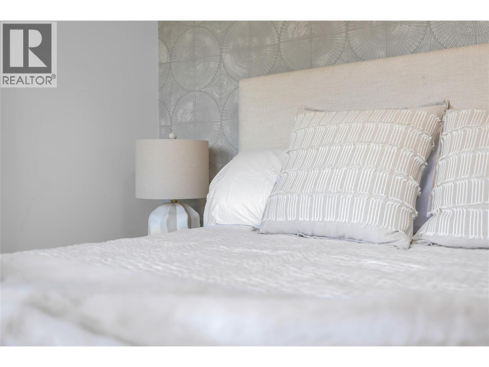 Bedroom 1. Photos may be of a similar home in the community. - 1455 Cara Glen Court Unit# 135, Kelowna, BC - Indoor Photo Showing Bedroom