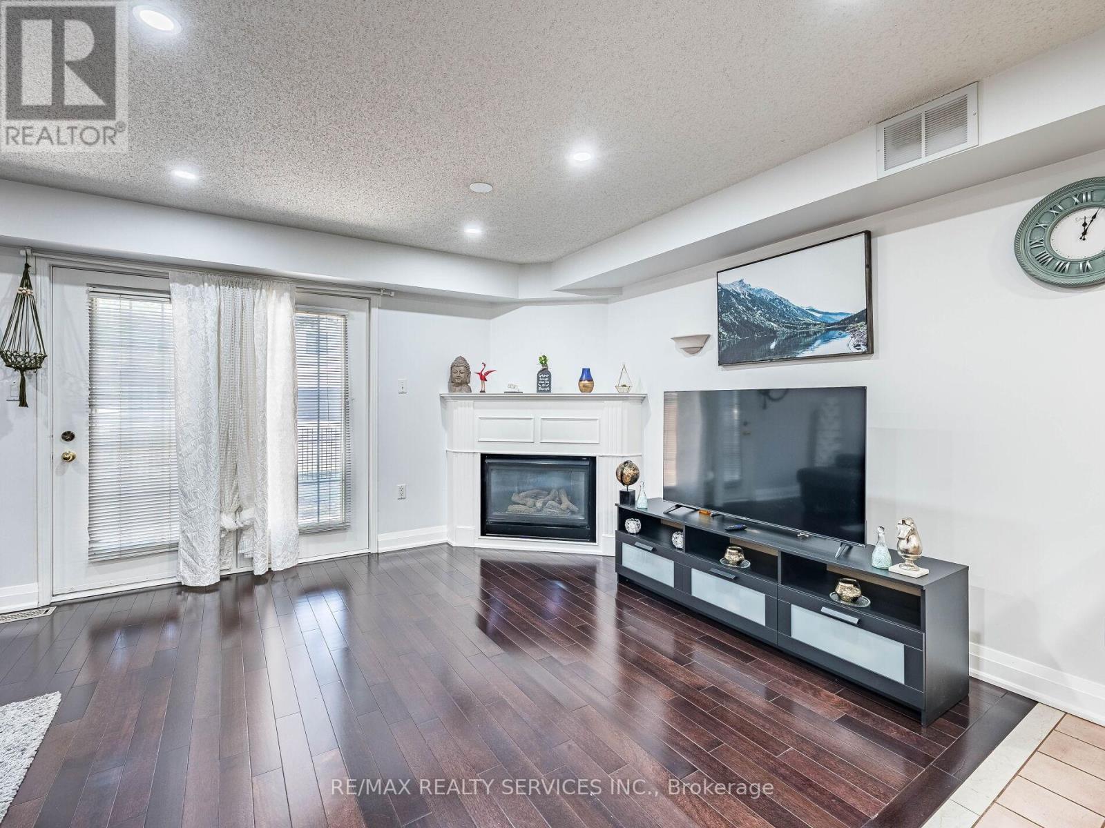 136 - 1995 Royal Road, Pickering, ON - Indoor Photo Showing Living Room With Fireplace