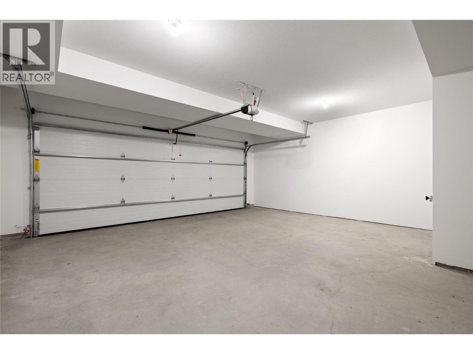 Garage - 1455 Cara Glen Court Unit# 129, Kelowna, BC - Indoor Photo Showing Garage