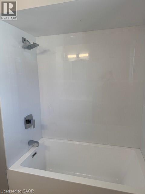 Bathroom featuring washtub / shower combination - 31 Adair Avenue, Hamilton, ON - Indoor Photo Showing Bathroom
