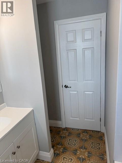Bathroom featuring vanity and baseboards - 31 Adair Avenue, Hamilton, ON - Indoor