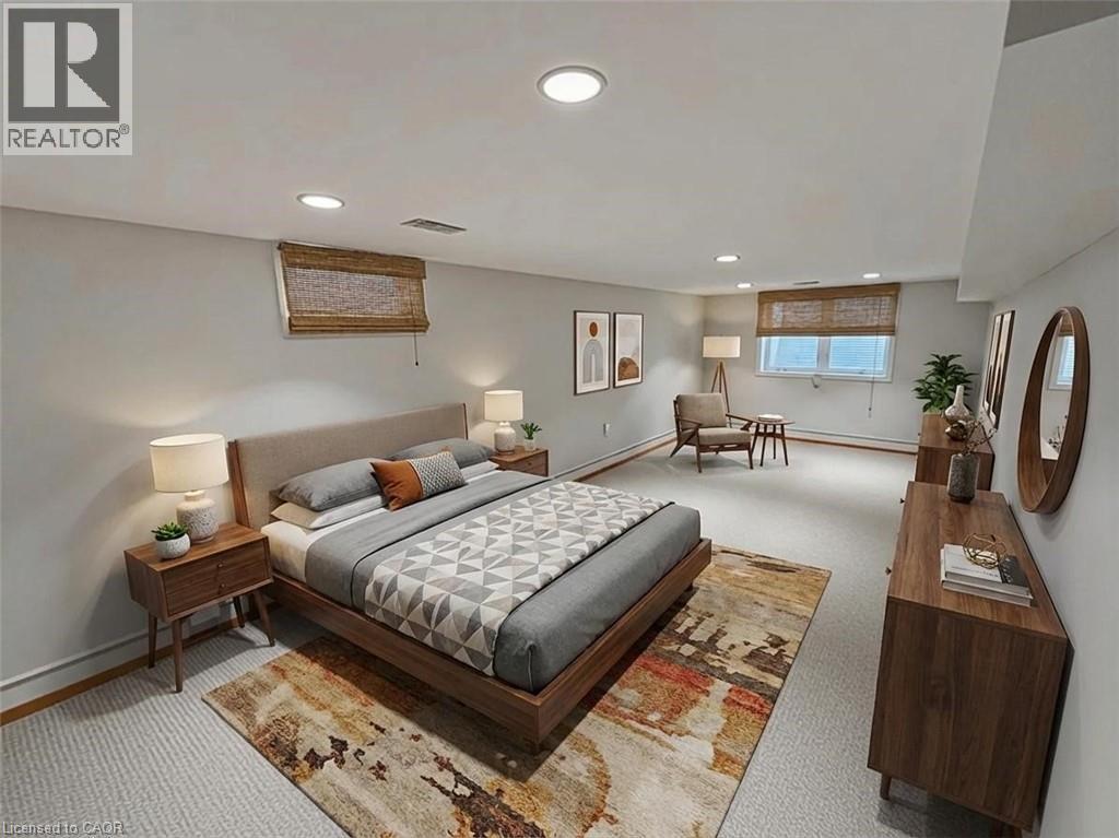 Bedroom featuring light carpet, recessed lighting. Basement. Virtually staged. - 122 Weber Street S, Waterloo, ON - Indoor Photo Showing Bedroom