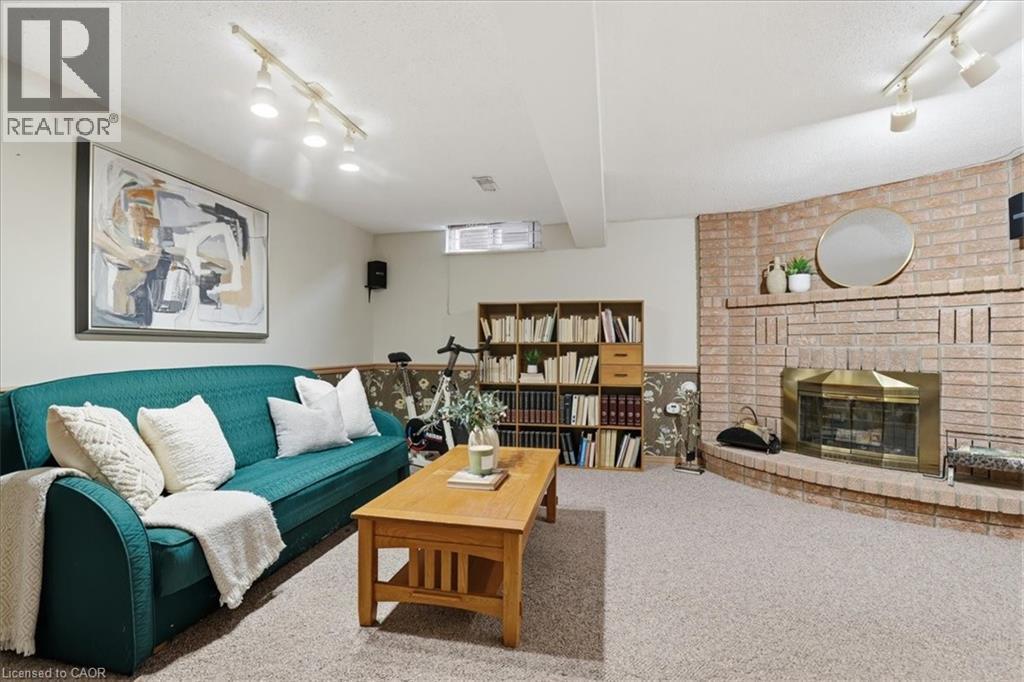 Basement Family Room - 56 Rushbrook Drive, Kitchener, ON - Indoor Photo Showing Living Room With Fireplace
