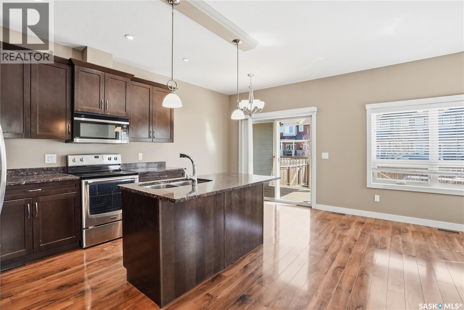 167 115 Shepherd Crescent, Saskatoon, SK - Indoor Photo Showing Kitchen With Stainless Steel Kitchen With Double Sink With Upgraded Kitchen