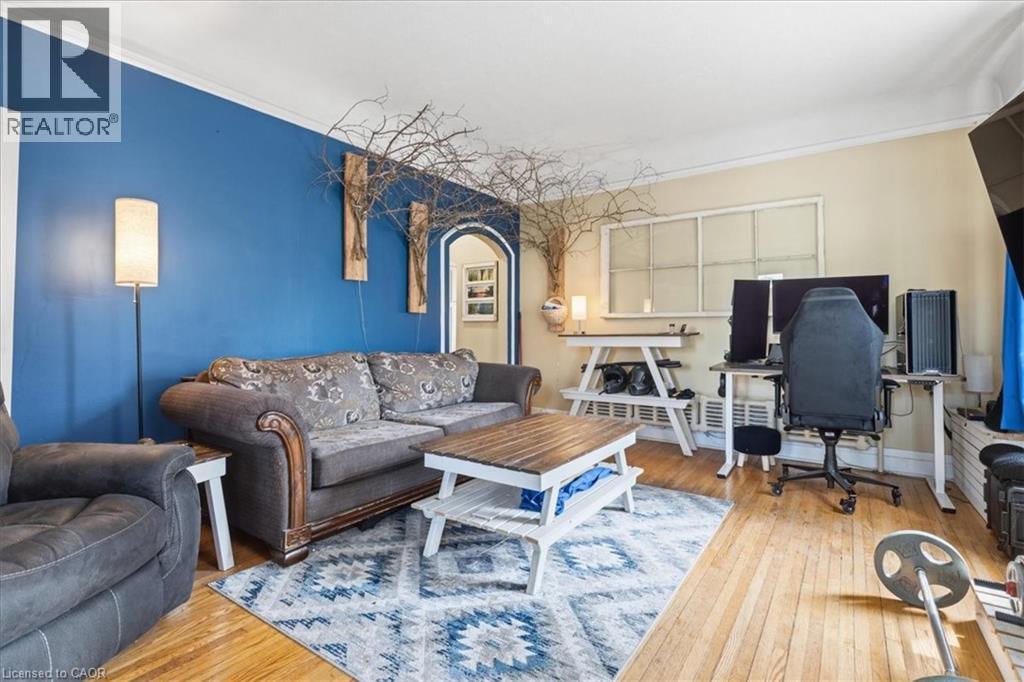 Large bright room with wood flooring - 31 Bingeman Street, Kitchener, ON - Indoor Photo Showing Living Room