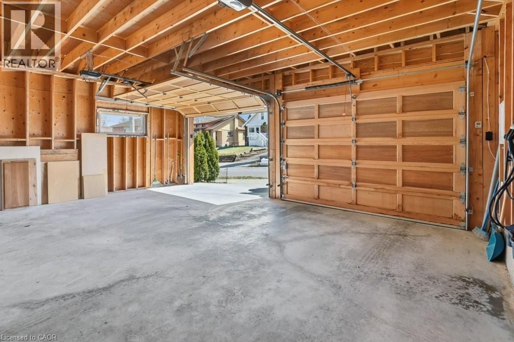 Large double car garage built in 2020 - 859 Queen'S Boulevard, Kitchener, ON - Indoor Photo Showing Garage