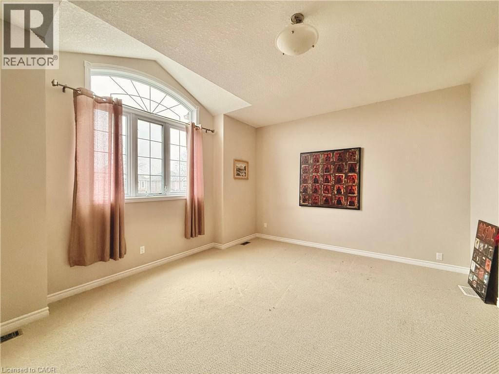 Spare room with light colored carpet - 101 Robert Simone Way, Ayr, ON - Indoor Photo Showing Other Room