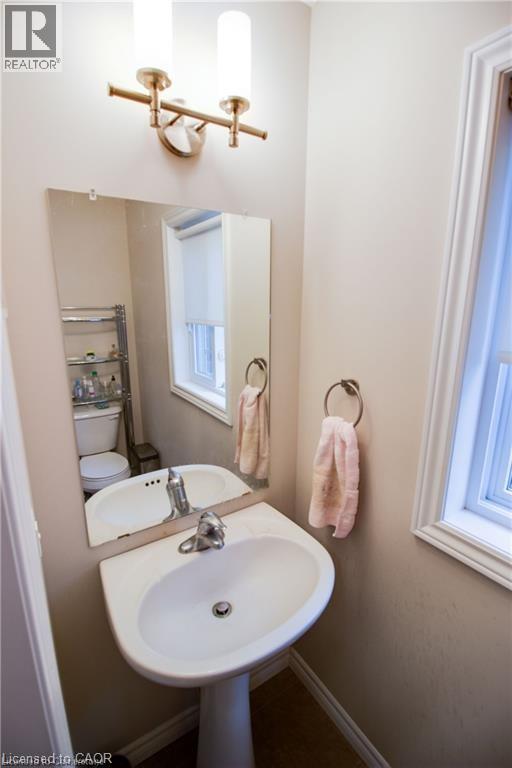 Bathroom with sink, a healthy amount of sunlight, and toilet - 101 Robert Simone Way, Ayr, ON - Indoor Photo Showing Bathroom