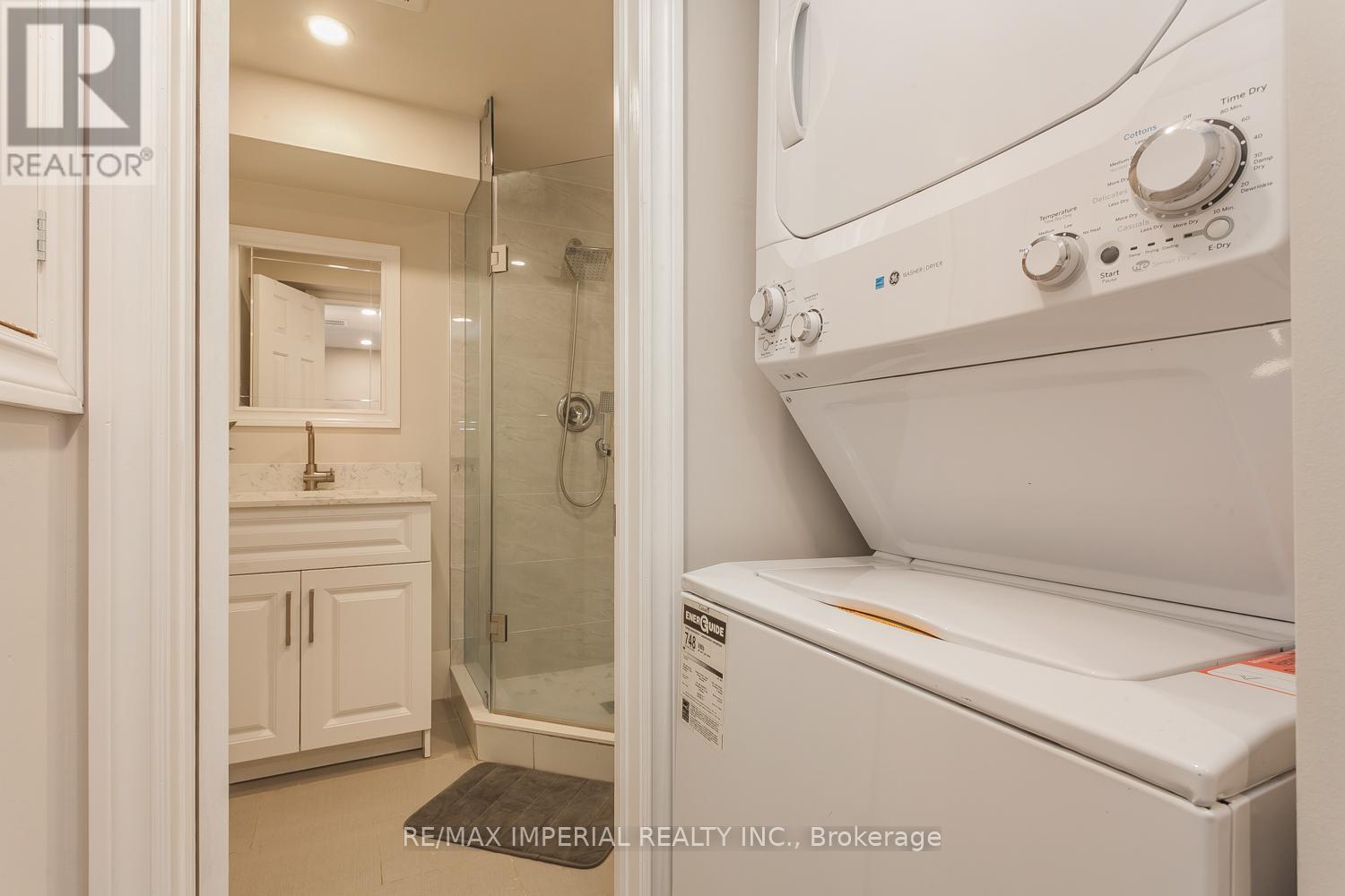 Stacked Washer/Dryer - 85 Maple Ridge Crescent E, Markham, ON - Indoor Photo Showing Laundry Room