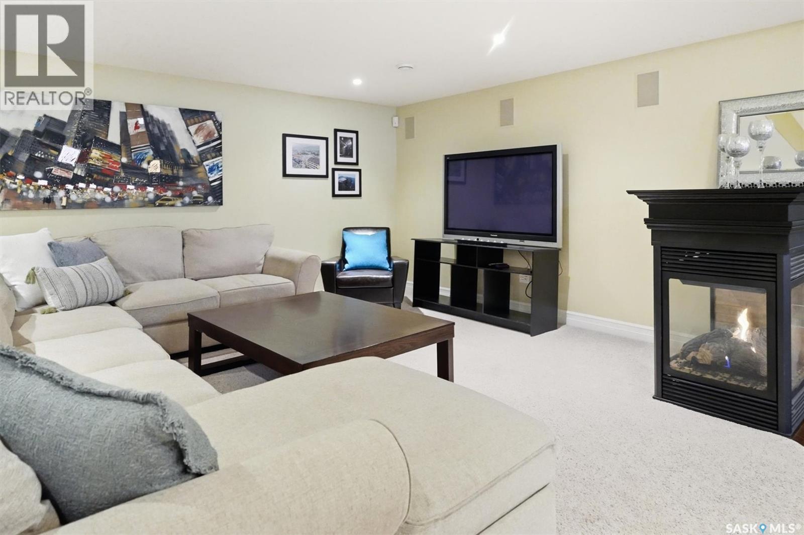 302 Brookhurst Terrace, Saskatoon, SK - Indoor Photo Showing Living Room With Fireplace