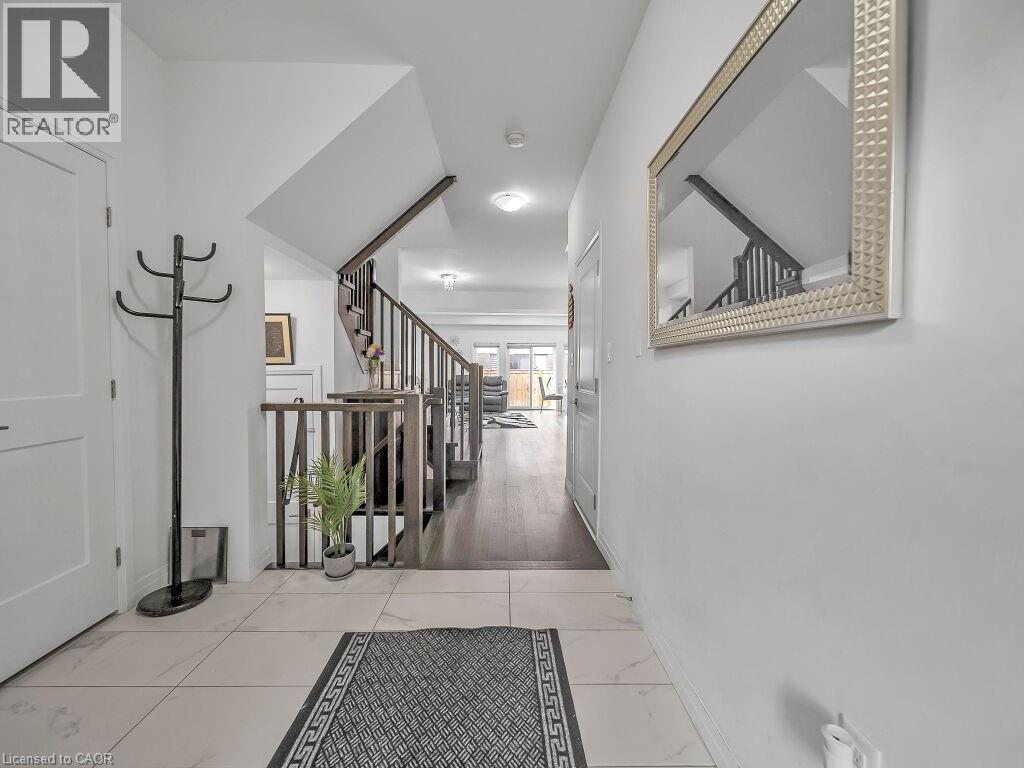 Hallway featuring stairs and baseboards - 30 Times Square Boulevard, Hamilton, ON - Indoor Photo Showing Other Room