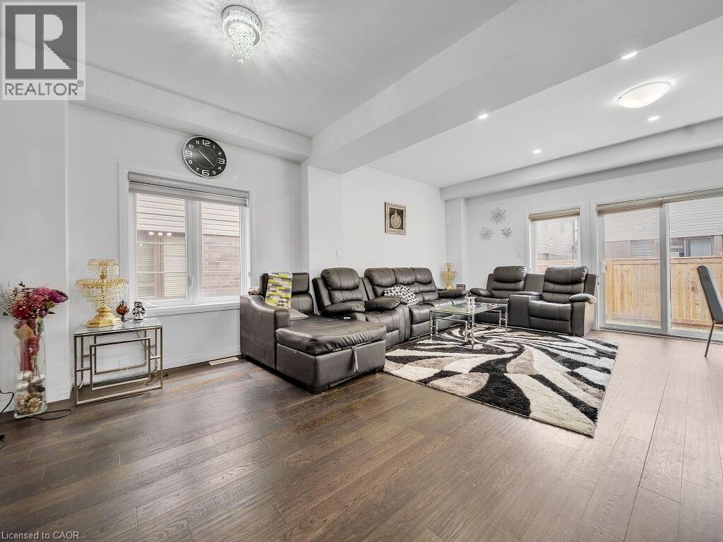 Living room with hardwood / wood-style floors and recessed lighting - 30 Times Square Boulevard, Hamilton, ON - Indoor Photo Showing Living Room