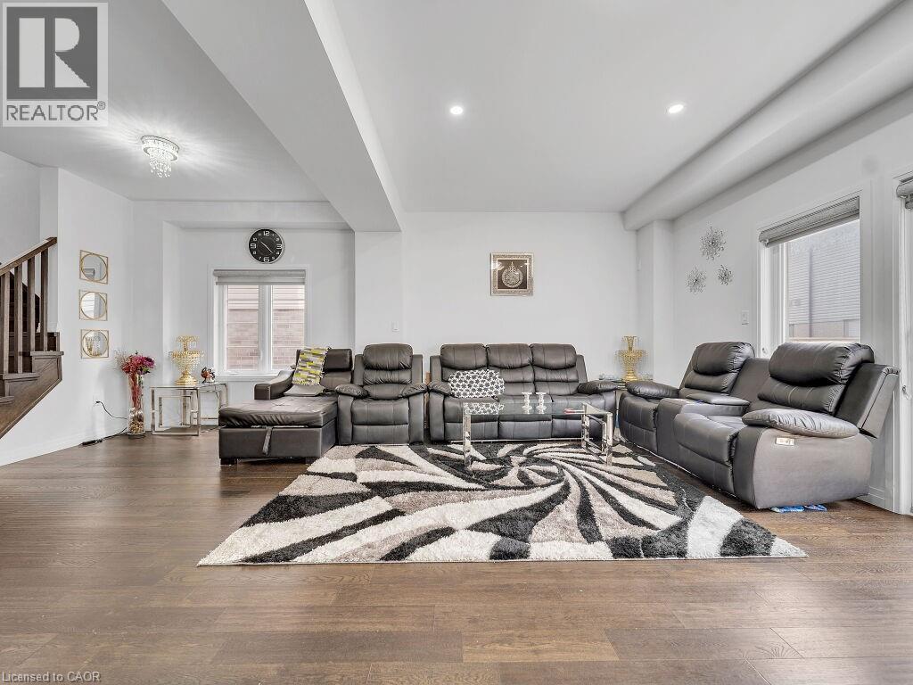 Living area featuring wood finished floors and recessed lighting - 30 Times Square Boulevard, Hamilton, ON - Indoor Photo Showing Living Room