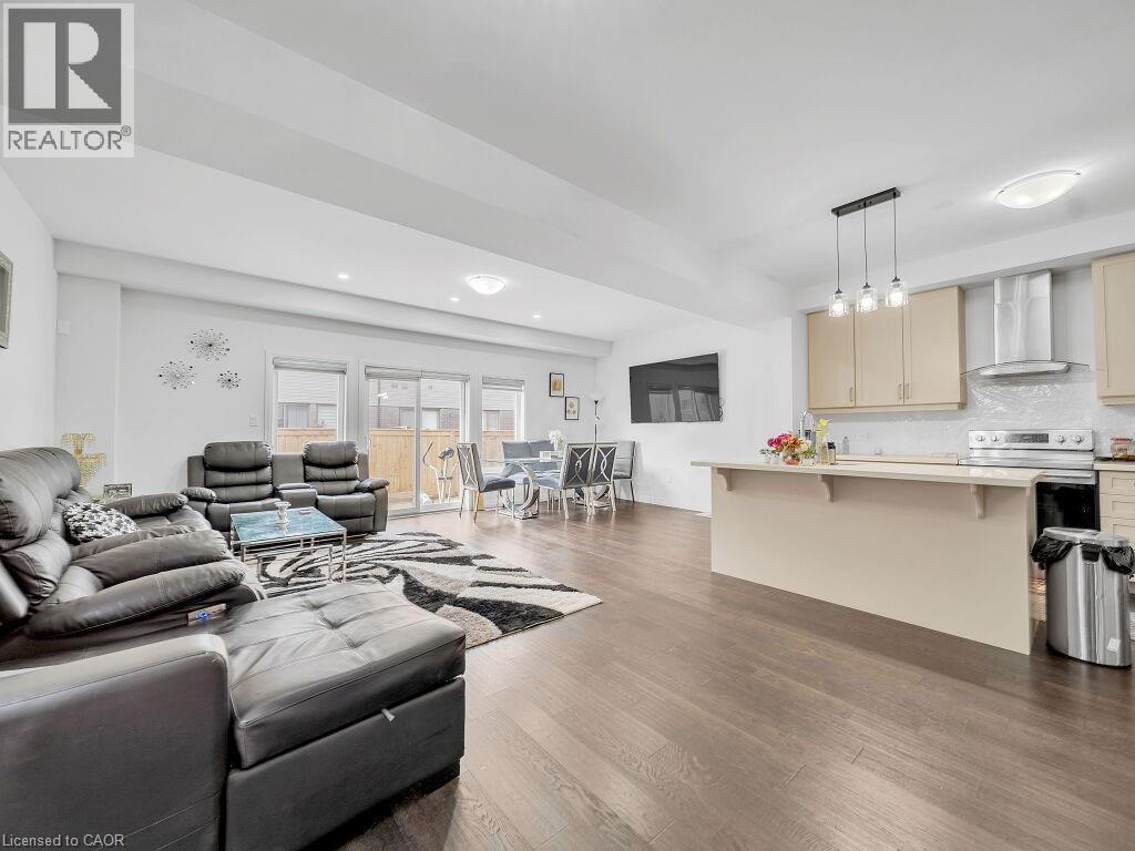 Living room featuring dark wood-style floors - 30 Times Square Boulevard, Hamilton, ON - Indoor