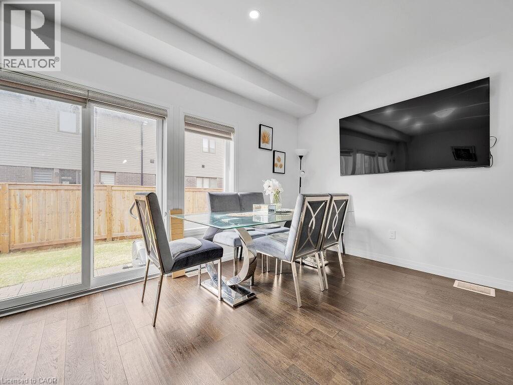 Dining room featuring wood finished floors and recessed lighting - 30 Times Square Boulevard, Hamilton, ON - Indoor Photo Showing Other Room