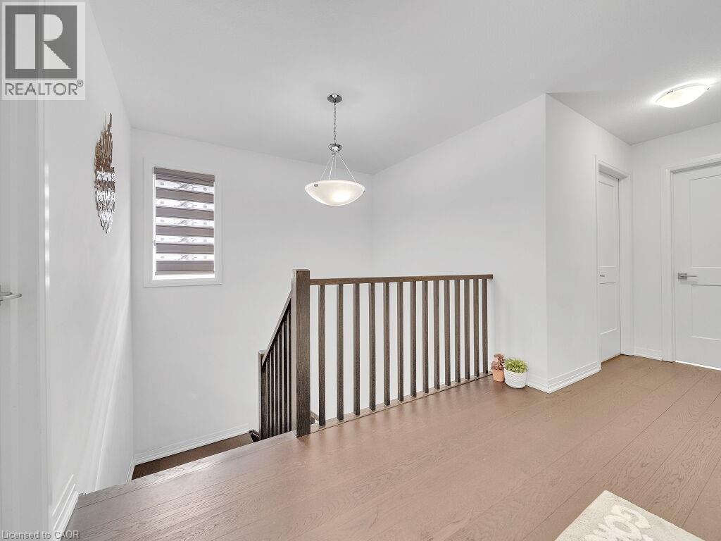 Hall with an upstairs landing and light wood-type flooring - 30 Times Square Boulevard, Hamilton, ON - Indoor Photo Showing Other Room