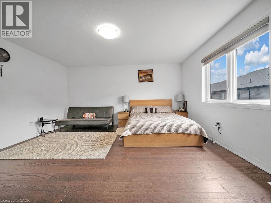 Bedroom with hardwood / wood-style floors and baseboards - 30 Times Square Boulevard, Hamilton, ON - Indoor Photo Showing Bedroom