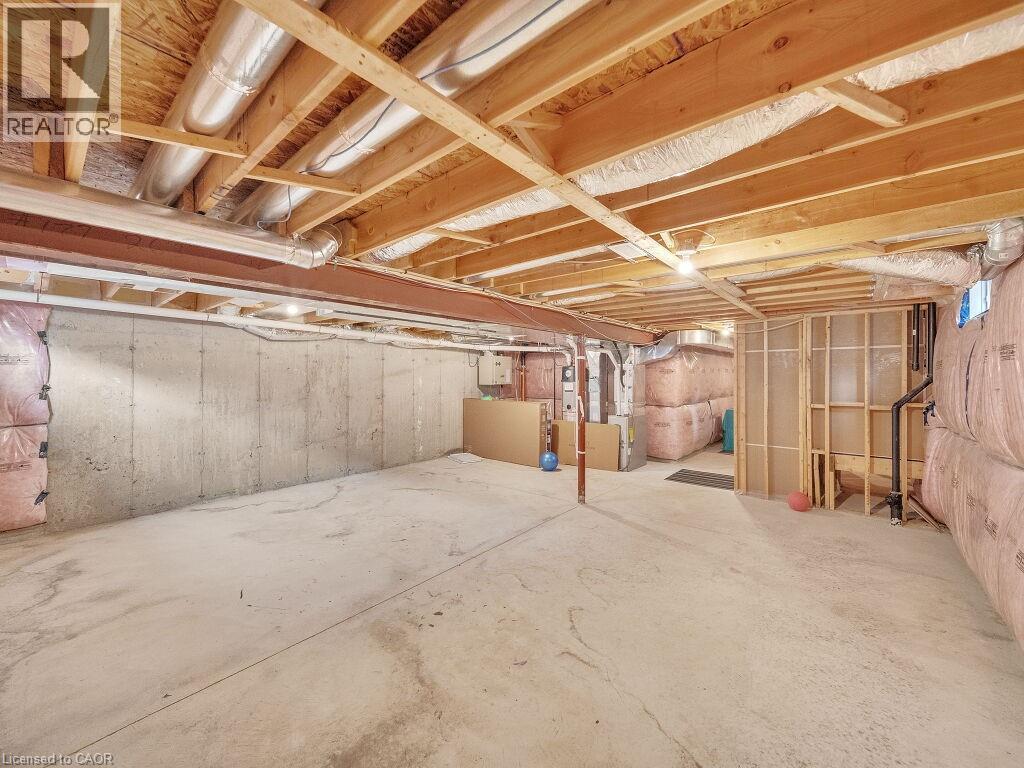 Unfinished below grade area with heating unit - 30 Times Square Boulevard, Hamilton, ON - Indoor Photo Showing Basement