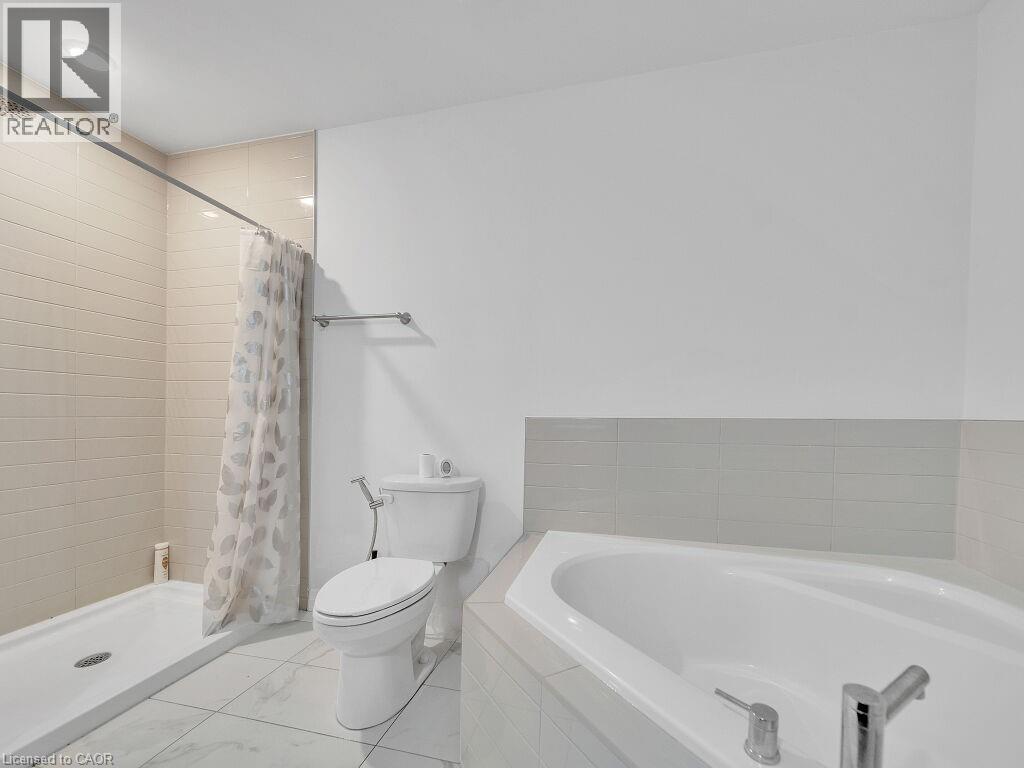 Bathroom with a stall shower and a bath - 30 Times Square Boulevard Unit# #177, Hamilton, ON - Indoor Photo Showing Bathroom