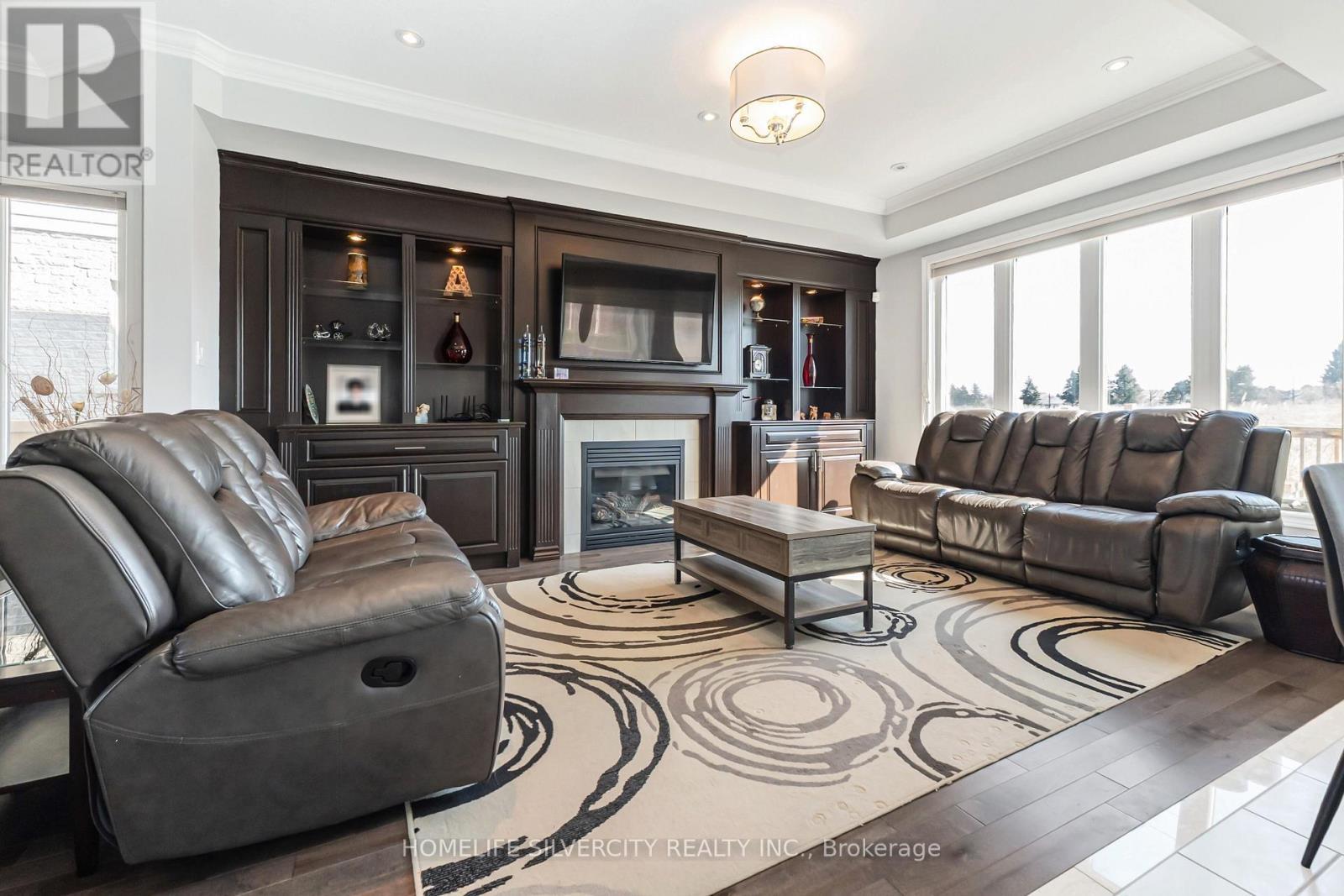 153 Medici Lane, Hamilton, ON - Indoor Photo Showing Living Room With Fireplace