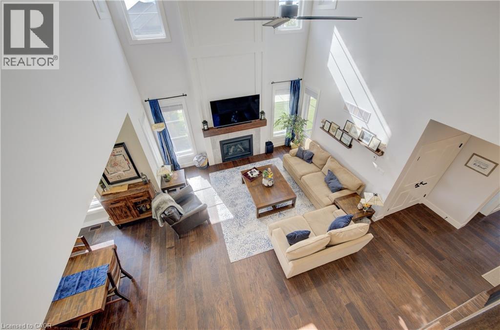 58 Carriage Crossing, Drayton, ON - Indoor Photo Showing Living Room With Fireplace