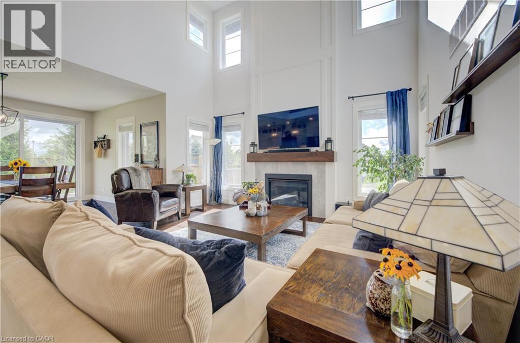 58 Carriage Crossing, Drayton, ON - Indoor Photo Showing Living Room With Fireplace