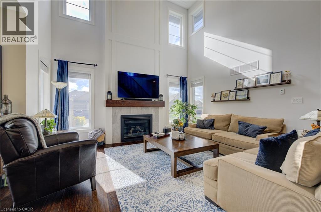 58 Carriage Crossing, Drayton, ON - Indoor Photo Showing Living Room With Fireplace