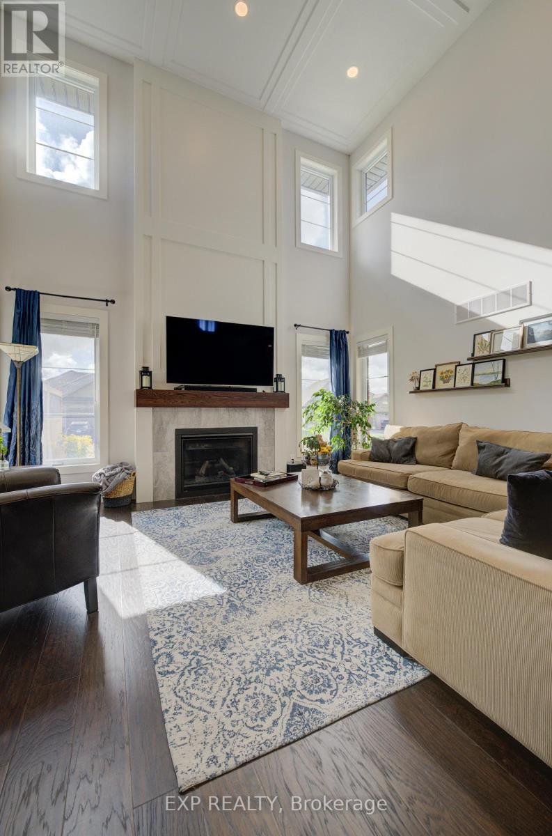 58 Carriage Crossing, Mapleton, ON - Indoor Photo Showing Living Room With Fireplace