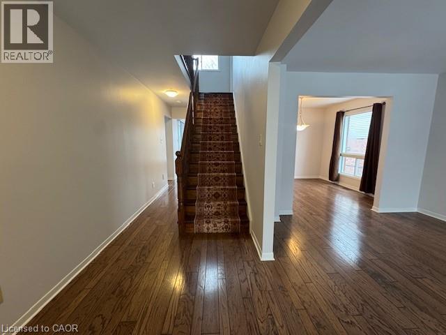 Staircase featuring hardwood / wood-style flooring and baseboards - 536 Thorndale Drive, Waterloo, ON - Indoor Photo Showing Other Room
