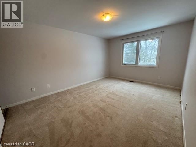 Unfurnished room featuring baseboards and light colored carpet - 536 Thorndale Drive, Waterloo, ON - Indoor Photo Showing Other Room