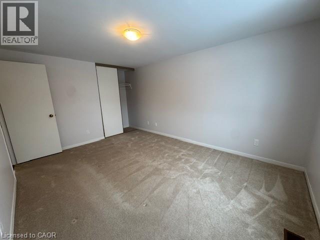 Unfurnished bedroom with a closet and carpet - 536 Thorndale Drive, Waterloo, ON - Indoor Photo Showing Other Room