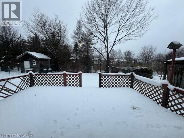 Yard covered in snow with a wooden deck - 536 Thorndale Drive, Waterloo, ON - Outdoor With Deck Patio Veranda