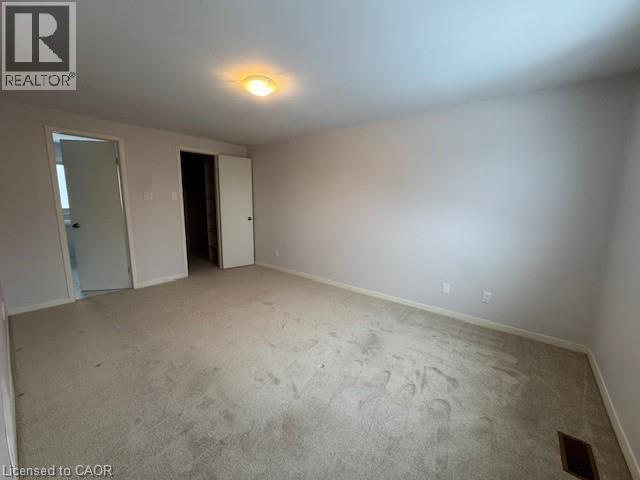 Unfurnished bedroom with light carpet and baseboards - 536 Thorndale Drive, Waterloo, ON - Indoor Photo Showing Other Room