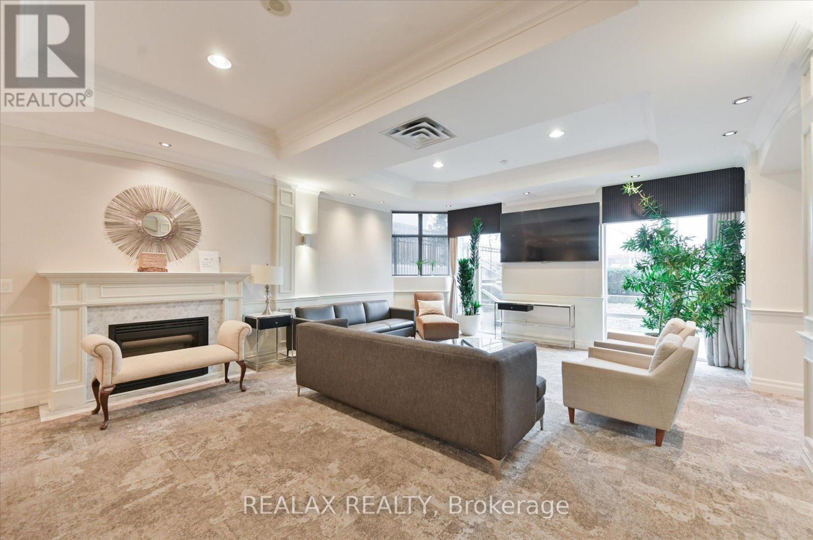 302 - 130 Pond Drive, Markham, ON - Indoor Photo Showing Living Room With Fireplace