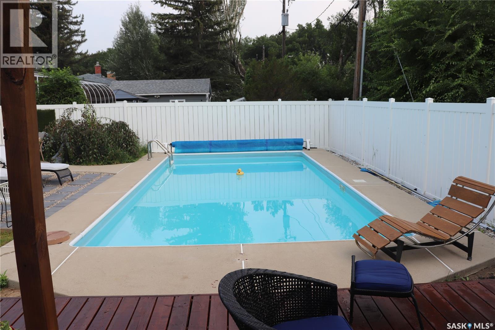 89 Patterson Drive, Regina, SK - Outdoor With In Ground Pool With Backyard