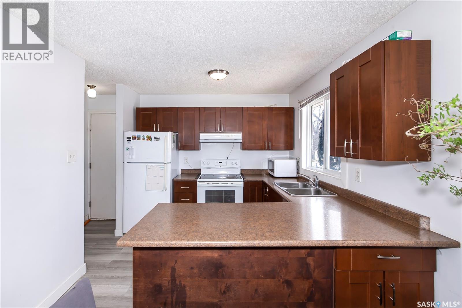 639 Redberry Road, Saskatoon, SK - Indoor Photo Showing Kitchen With Double Sink