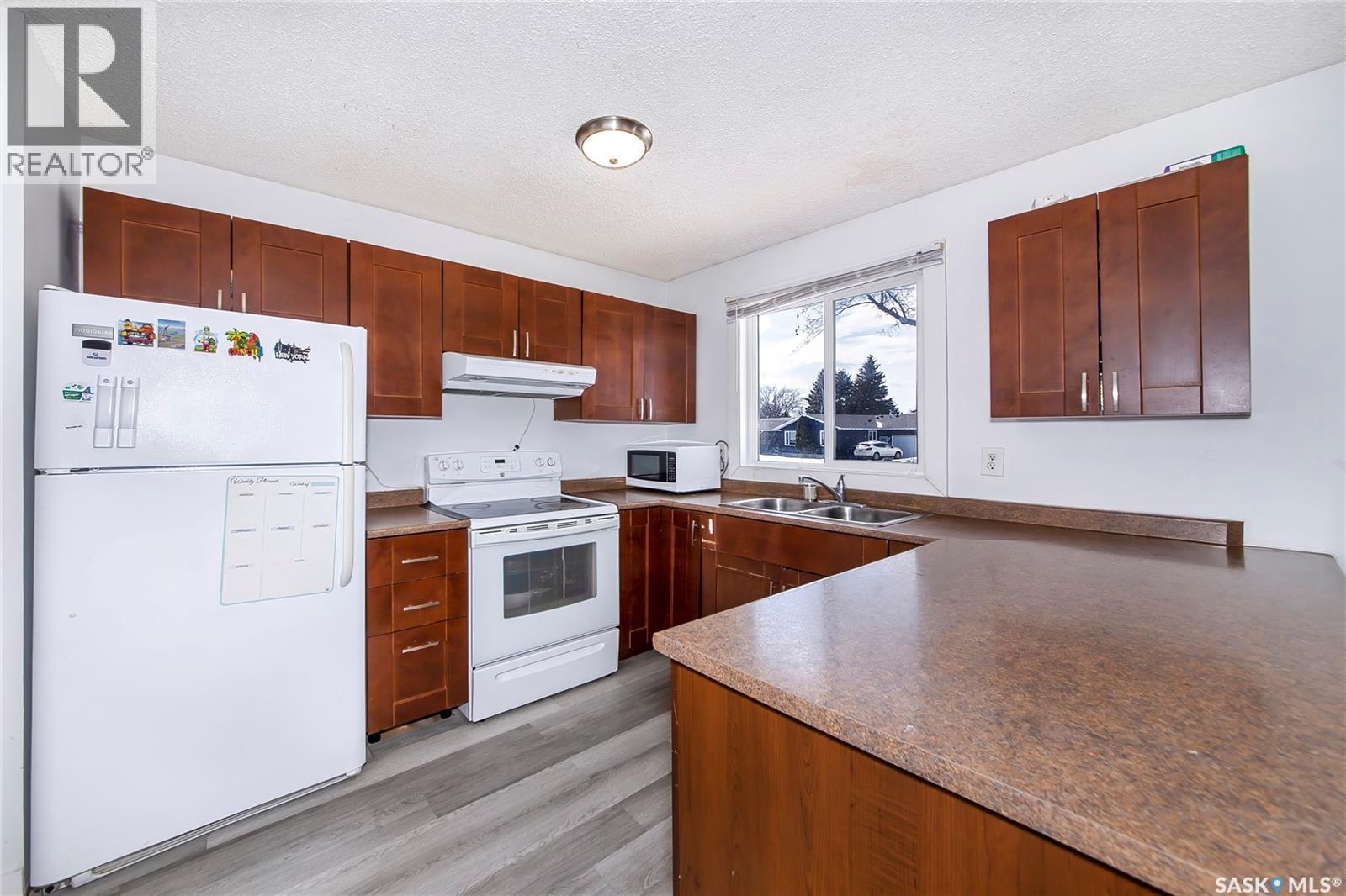 639 Redberry Road, Saskatoon, SK - Indoor Photo Showing Kitchen With Double Sink
