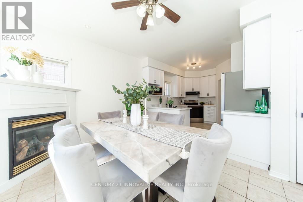 63 Rainbow Valley Crescent, Markham, ON - Indoor Photo Showing Dining Room With Fireplace