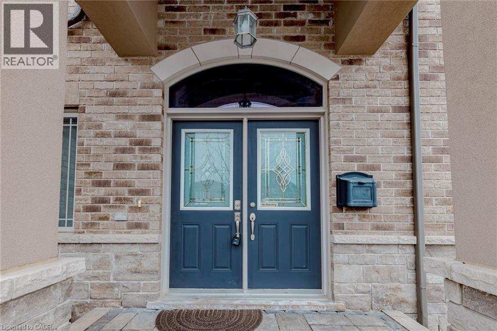 Doorway to property featuring brick siding - 2 Doon Creek Street, Kitchener, ON - Outdoor