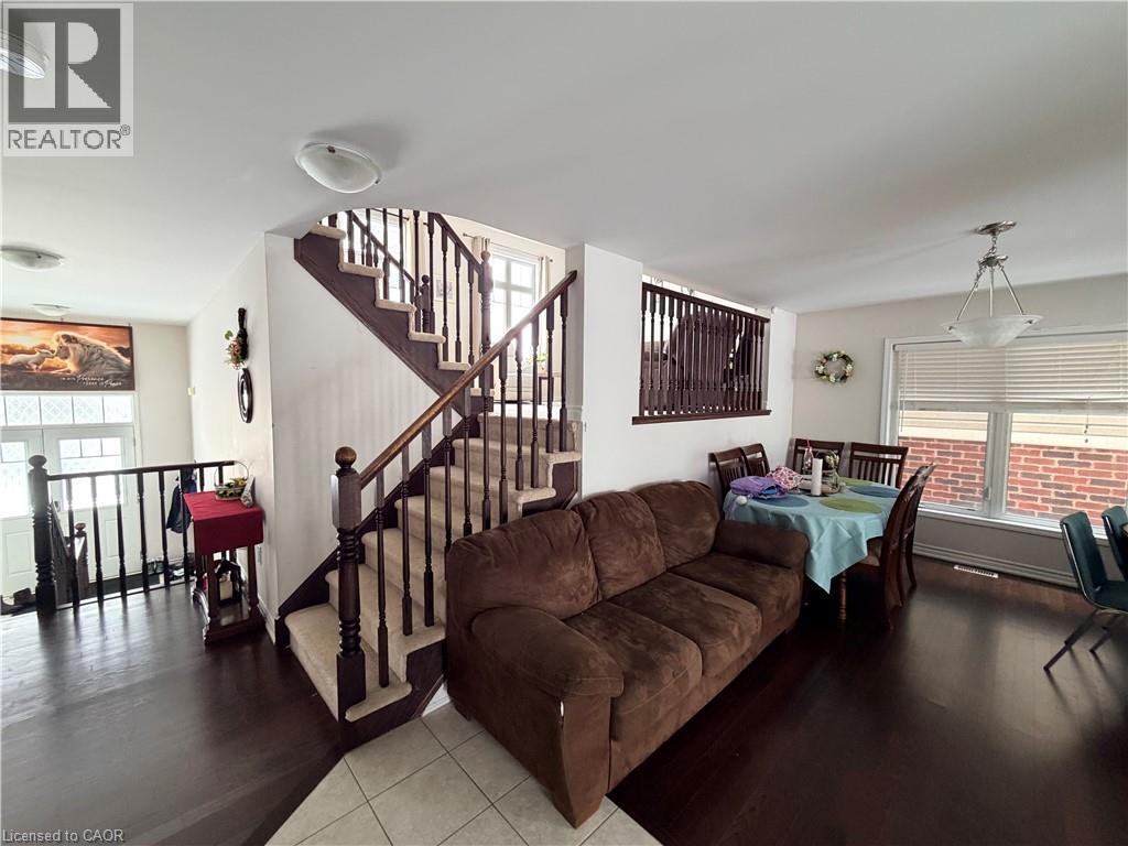 Living area featuring healthy amount of natural light and wood finished floors - 31 Sofitel Drive, Kitchener, ON - Indoor Photo Showing Living Room