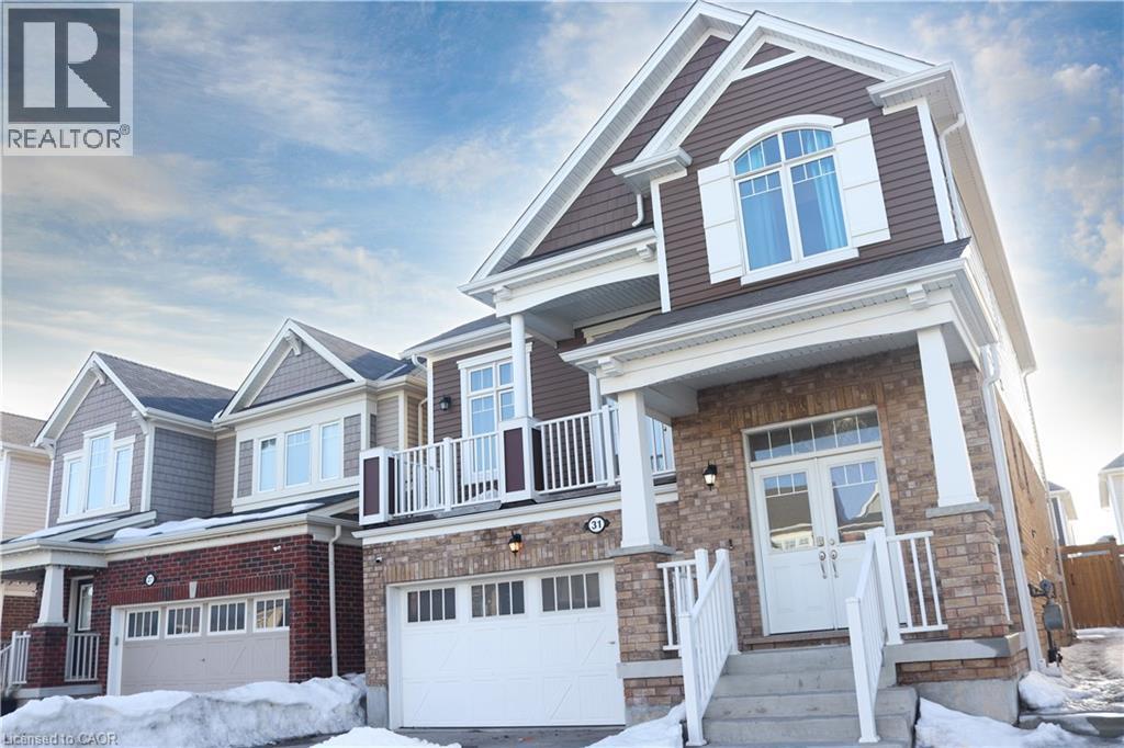 Craftsman inspired home featuring a garage, a balcony, stone siding, and brick siding - 31 Sofitel Drive, Kitchener, ON - Outdoor With Balcony With Facade