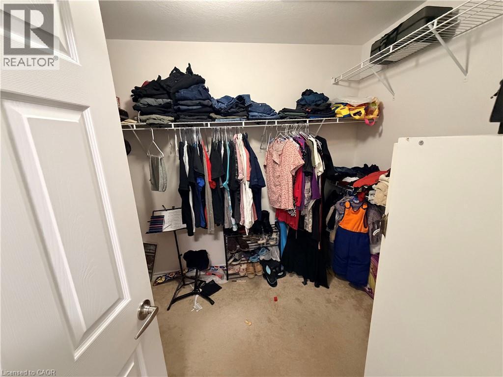 View of walk in closet - 31 Sofitel Drive, Kitchener, ON - Indoor With Storage