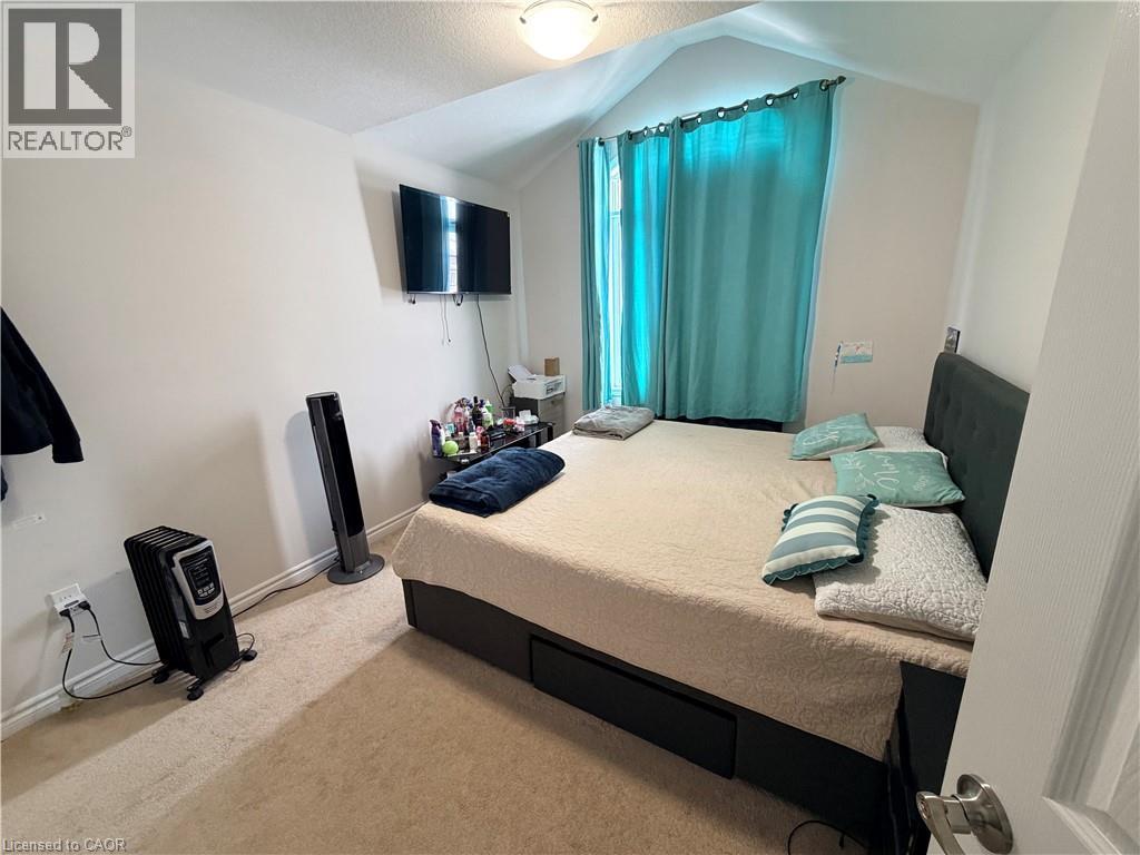 Bedroom featuring light colored carpet and baseboards - 31 Sofitel Drive, Kitchener, ON - Indoor Photo Showing Bedroom