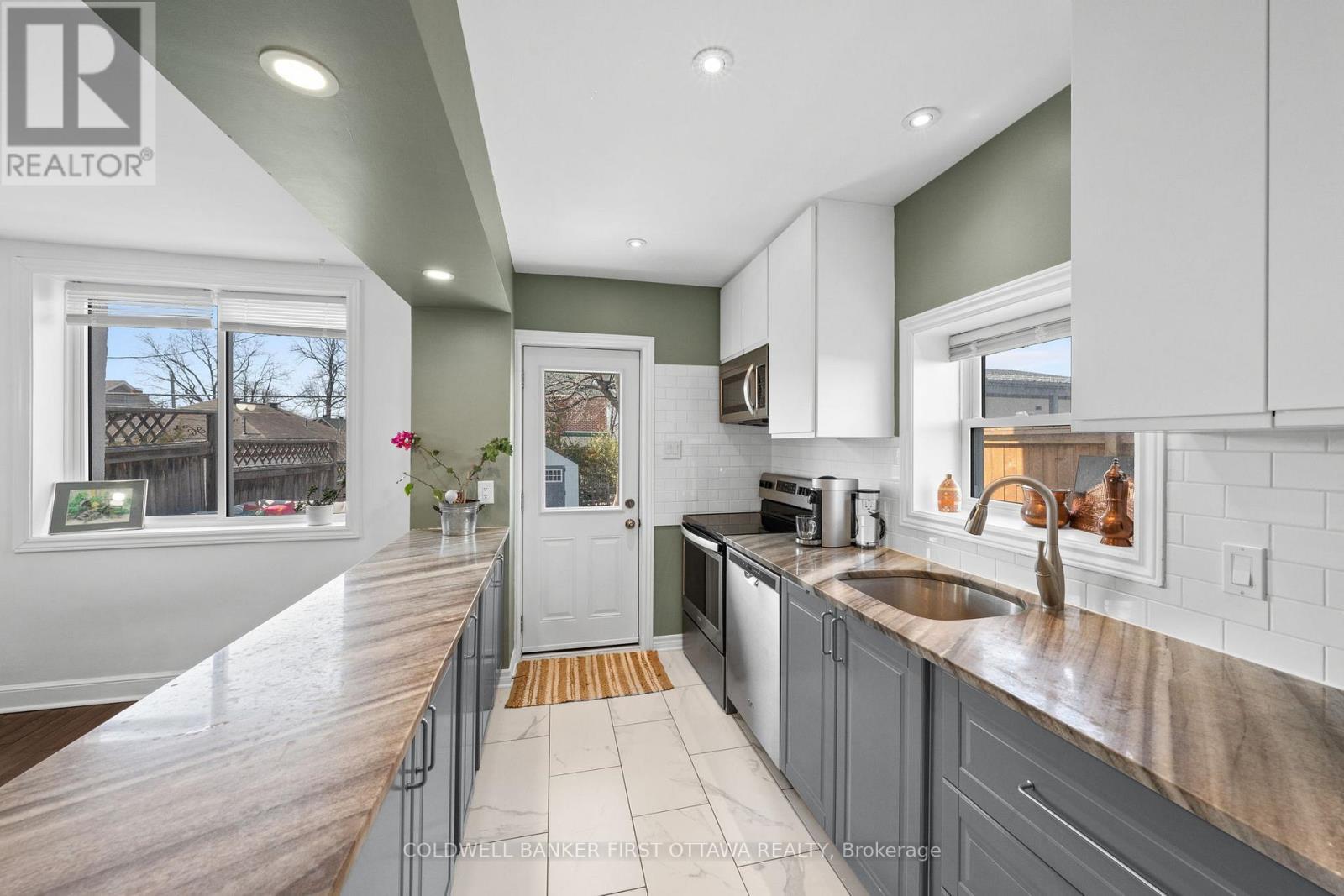 Marble countertops & stainless steel appliances! - 12 Stevenson Avenue, Ottawa, ON - Indoor Photo Showing Kitchen