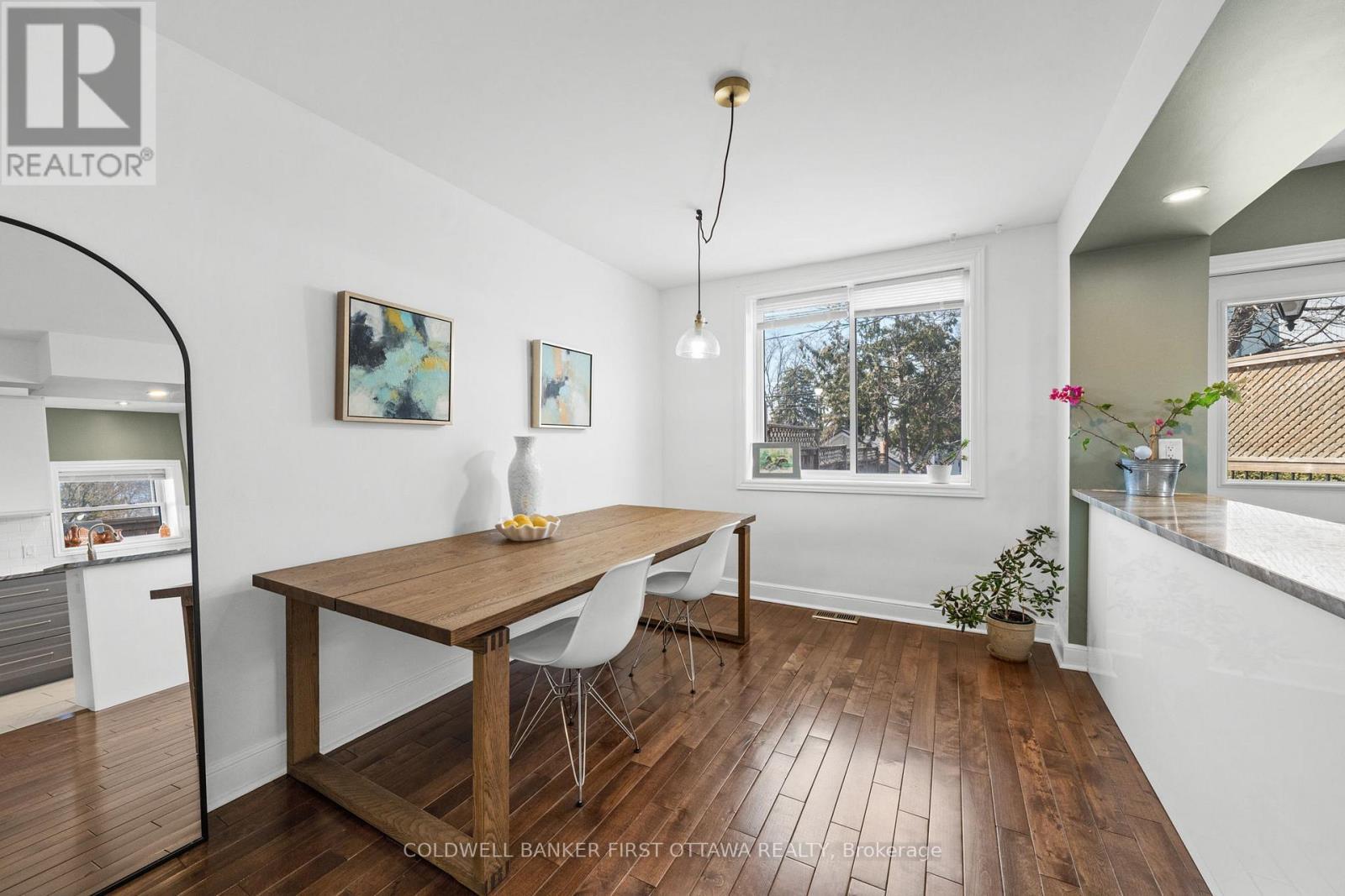 Dining room w expansive window & hanging fixture. - 12 Stevenson Avenue, Ottawa, ON - Indoor Photo Showing Other Room