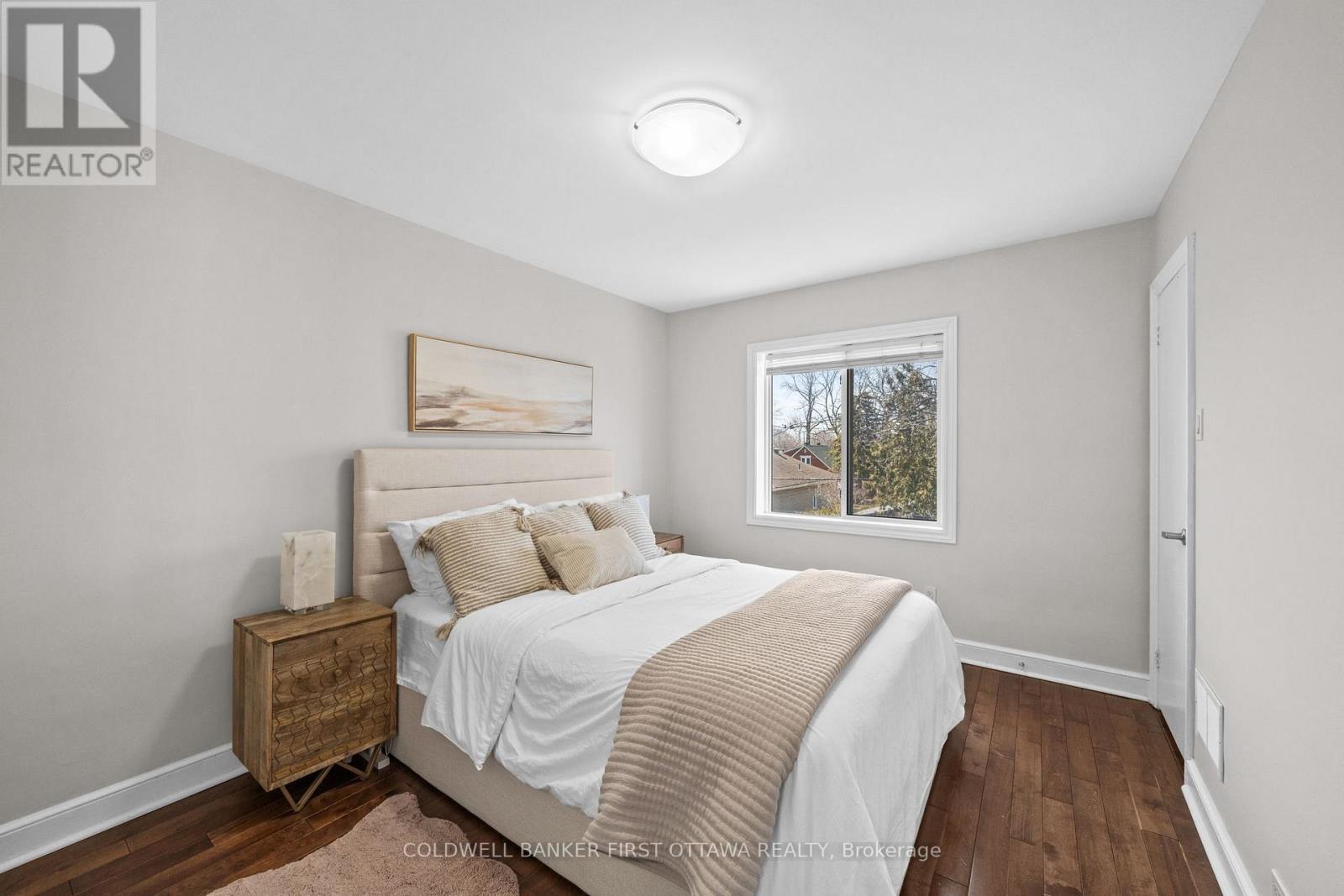 Primary bedroom window and walk in closet! - 12 Stevenson Avenue, Ottawa, ON - Indoor Photo Showing Bedroom