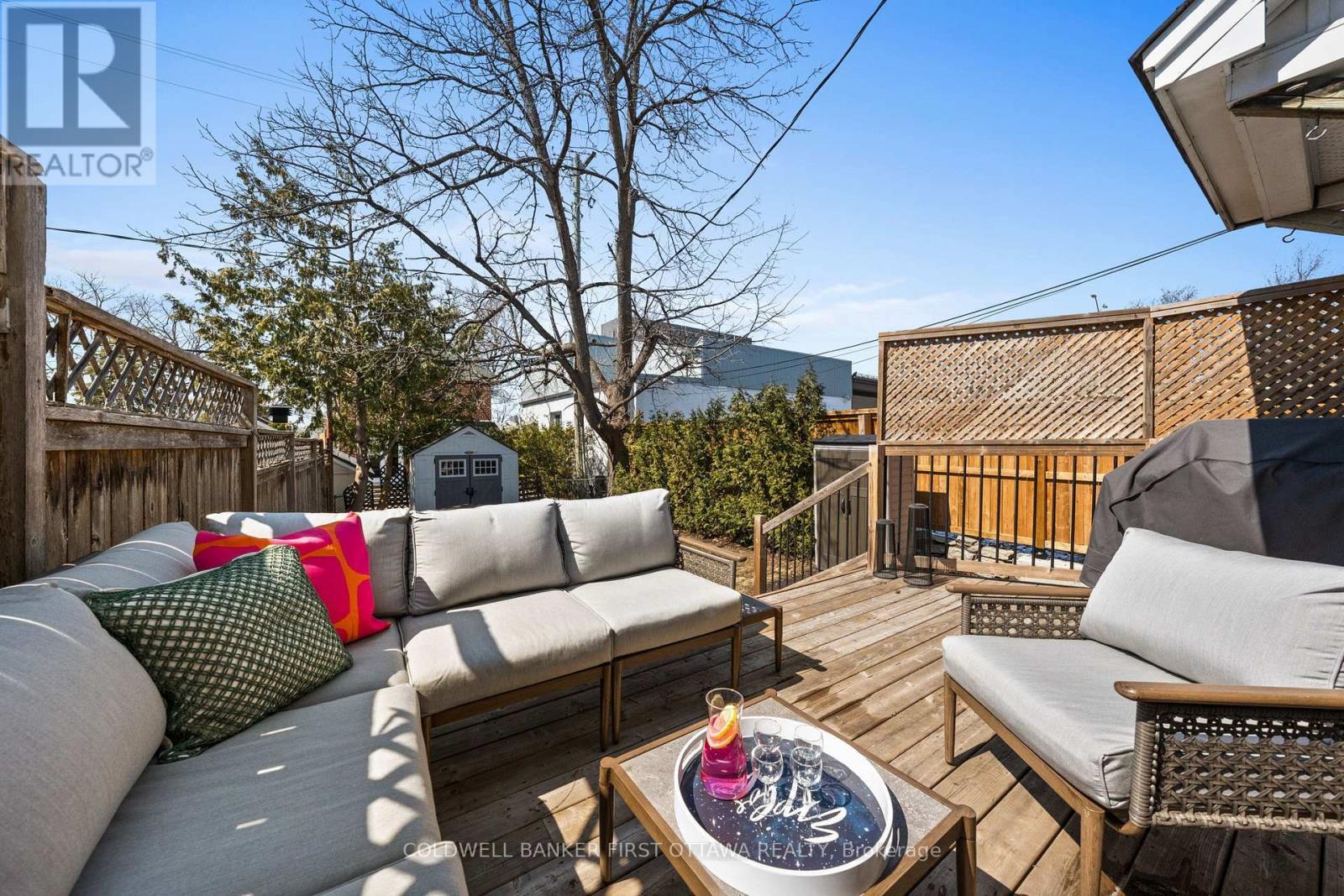 Walkout from kitchen to lounge area w BBQ space. - 12 Stevenson Avenue, Ottawa, ON - Outdoor With Deck Patio Veranda
